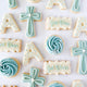 thumbnail for Blue or Pink Cross + Letter Sugar Cookies